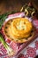 Feta cheese and green onion fried pies section on a rustic plate