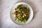 Feta cheese strawberry cucumber rocket arugula salad with pecan nuts