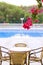 Fethiye, Turkey, September 2017. Comfortable high-rise hotel. Branch magenta bougainvillea flowers on blue swimming pool, wicker