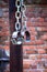 Fetters, manacles on brick background