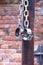 Fetters, manacles on brick background