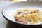 Fettuccine carbonara, fettuccine pasta spaghetti with bacon ham and mushroon in white sauce italian food