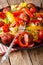 Fettuccine pasta with bell pepper, grilled sausages and tomato c