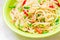 Fettuccine pasta salad with tomatoes, cucumbers and peppers