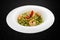 Fettuccini with shrimp and pesto sauce. Isolated image