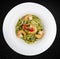 Fettuccini with shrimp and pesto sauce. Isolated image