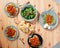 Fetuchini pasta with beef tomato sauce on wood table , italian food. Fresh salad in a gray plate with arugula