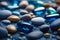 a few beautiful pebbles glisten with a soft light deep blue sea spark