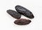 Few dried tonka beans close up on gray