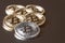 A few gold and silver coins bitcoin lie or stay on edge on a dark background. The concept of crypto currency.