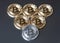 A few gold and silver coins bitcoin lie or stay on edge on a dark background. The concept of crypto currency.