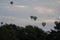 A few hot air balloons in the sky during sunrise in Bagan, Nyaung-U, Myanmar