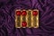 A few left red hearts in the golden box againts elegant purple satin or silk wave background. Looks like a healthy pills box