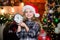 Few minutes till new year. Magic moment is coming. Christmas almost here. Girl santa claus hat and clock. Meet Christmas