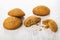 Few of oat cookies, broken cookie and crumbs on table