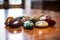 a few polished meditation stones artfully arranged on a wooden table
