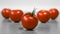 A few red ripe tomatos on a table for healthy nutrition