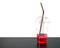 few red sweet drink with straw in transparent plastic cup on wooden kitchen counter floor