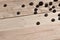 A few rusty nuts lies on a wooden table in a workshop