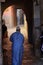 Fez, Morocco - December 07 2018:Moroccan senior gentleman dressed in blue, going through a passage in the medina of fez