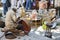 FEZ, MOROCCO, MAY 31, 2012- Artisan man pounding copper pot in old Medina souk of Fez