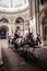 Fiaker Horses Pull Carriage With Tourists And Tour Guide Through Imperial Residence Passage Hofburg In Vienna In Austria