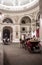 Fiaker Horses Pull Carriage With Tourists And Tour Guide Through Imperial Residence Passage Hofburg In Vienna In Austria