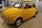 Fiat 500 yellow vintage model old timer car sixties in showroom