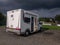 Fiat Ducato Rapido caravan parked for a short relax when travelling with a storm coming in the background