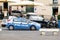 Fiat Grande Punto car of the Sicilian police Polizia in Siracusa driving on the streets of the city with slight motion blur