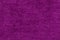 fiber texture polyester close-up. pink fleecy background. shaggy surface. fine grain felt red fabric