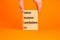 FICA symbol. Concept words FICA federal insurance contributions act on wooden block on beautiful orange background. Business FICA