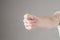 Fico gesture of a hand on a white background