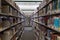 The fiction aisle of a public library showing rows of books