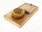 Fictitious crypto coin standing on mouse trap. 3D illustration