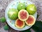 Ficus domestica, figs on small plate, flat lay, sliced and whole