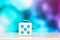 Fidget cube anti stress toy. Detail of finger play toy used for relax. Gadget placed on colorful bokeh background