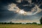 Field agriculture and rain clouds with sunrays