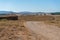 Field with bales of wheat drying in the sun in the mountains