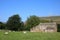 Field barn with sheep grazing in surrounding field