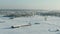 The field covered with snow in a winter season. Winter landscape of countryside, forest, field, trees covered with snow.