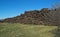 Field with giant pile of railway cross ties