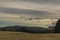 Field and hills near Svaty Jan nad Malsi village in cloudy day in south Bohemia