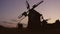 Field of historical windmills while twilight.