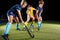 Field hockey female players struggle for the ball