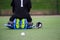 Field hockey goalkeeper on a green grass