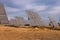 Field of photovoltaic solar panels gathering energy.