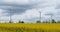 Field of rapeseed Brassica napusand wind turbines in the Cotes d Armor department in Brittany, France