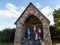 Field stone grotto calvary with statues of holy family
