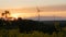 field - sunset with wind turbine.